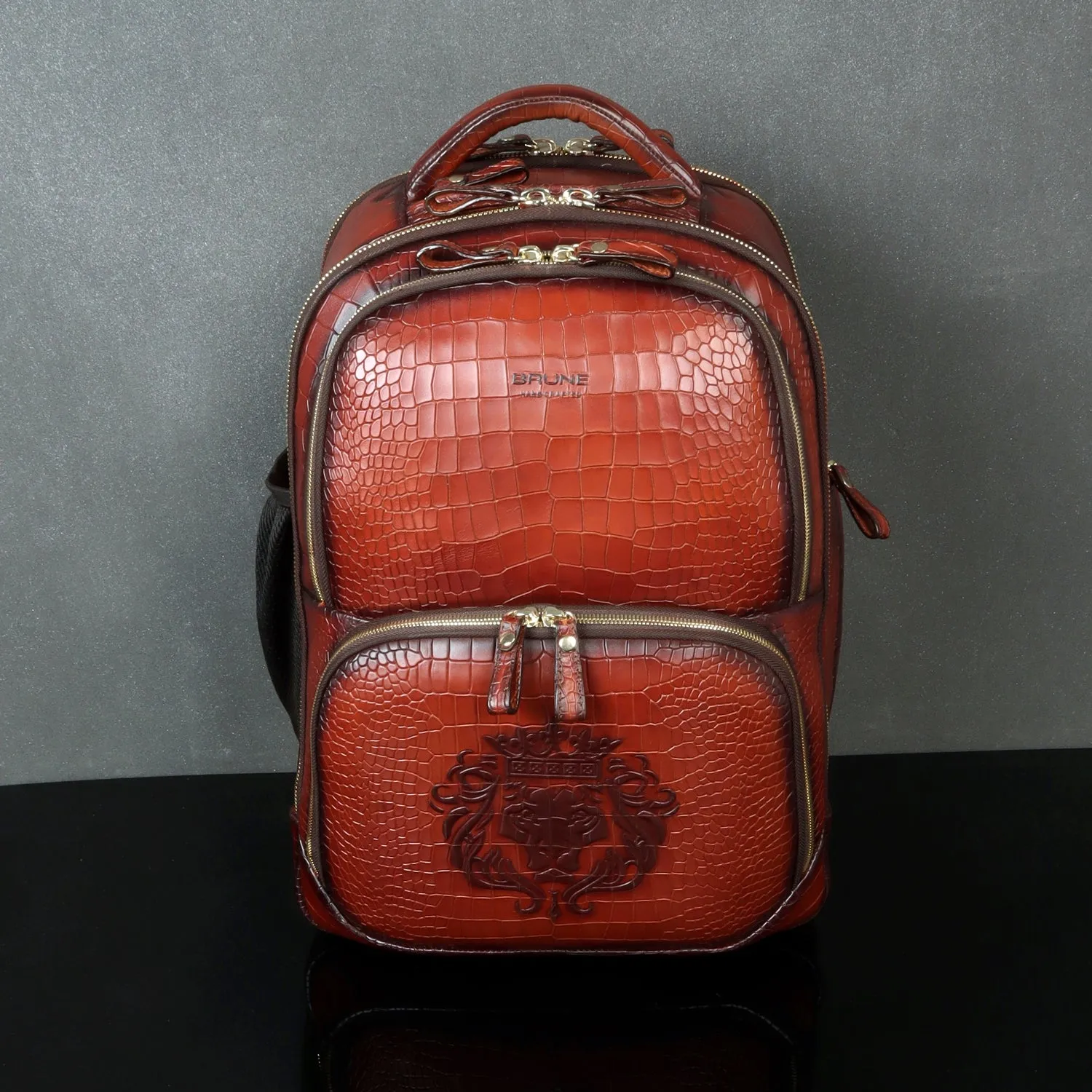 Tan Deep Cut Croco Print Leather Backpack Embossed Lion Multi-Step Pockets By Brune & Bareskin