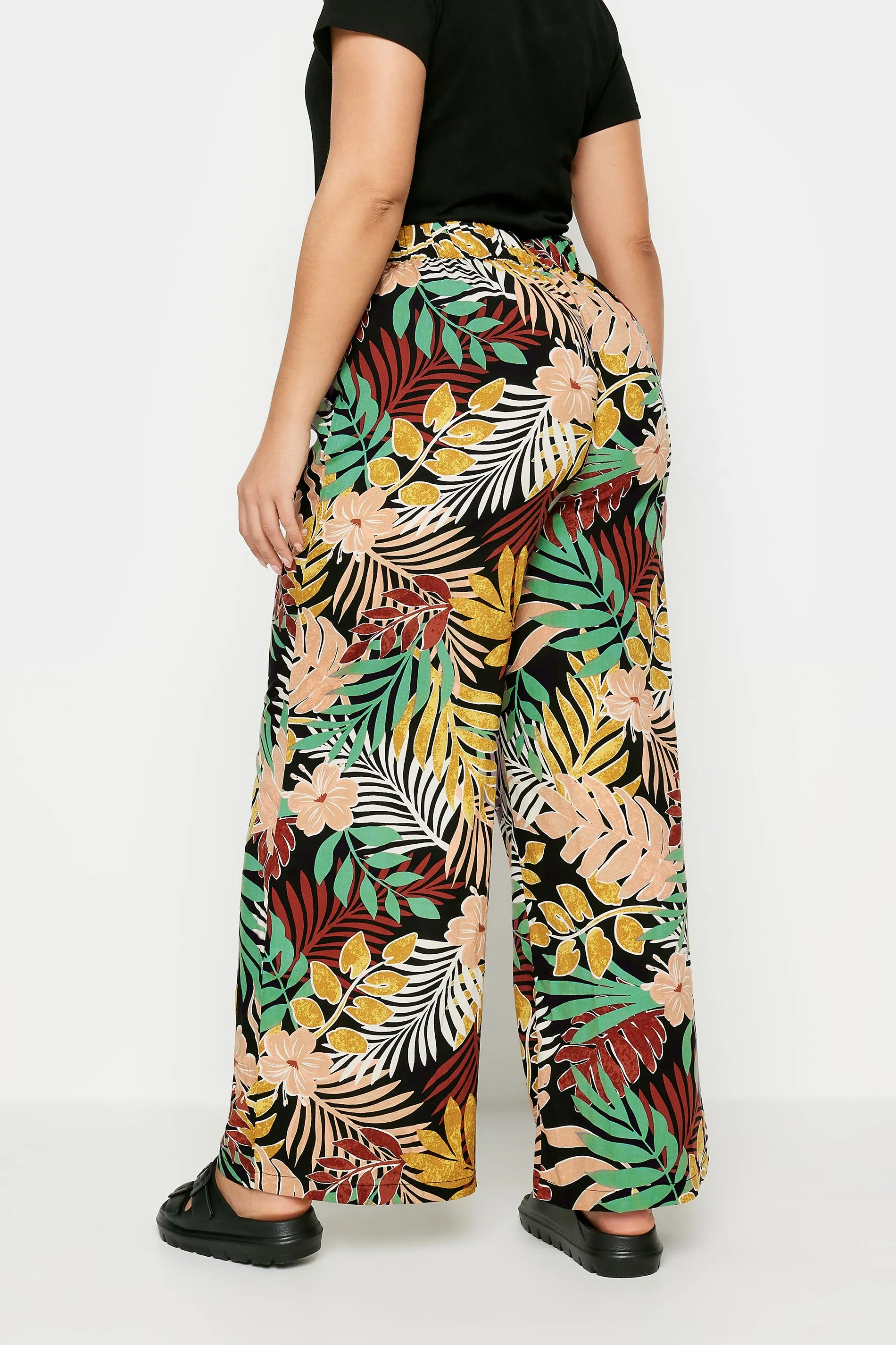 YOURS Curve Black Tropical Print Wide Leg Trousers